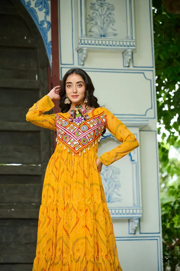 Celebrate_this_Navratri_in_full_color_and_culture_with_our_stunning_traditional_maxi_dresses._Featuring_bold_Bandhani_prints_and_handcrafted_mirror-work_yokes,_each_outfit_radiates_ethnic_charm._Choose_your_festive_hue_—_Sunshine_Yellow,_Royal_Purple,_Electric_Blue,_or_Fiery_Red_—_and_dance_through_the_nights_in_comfort_and_elegance.