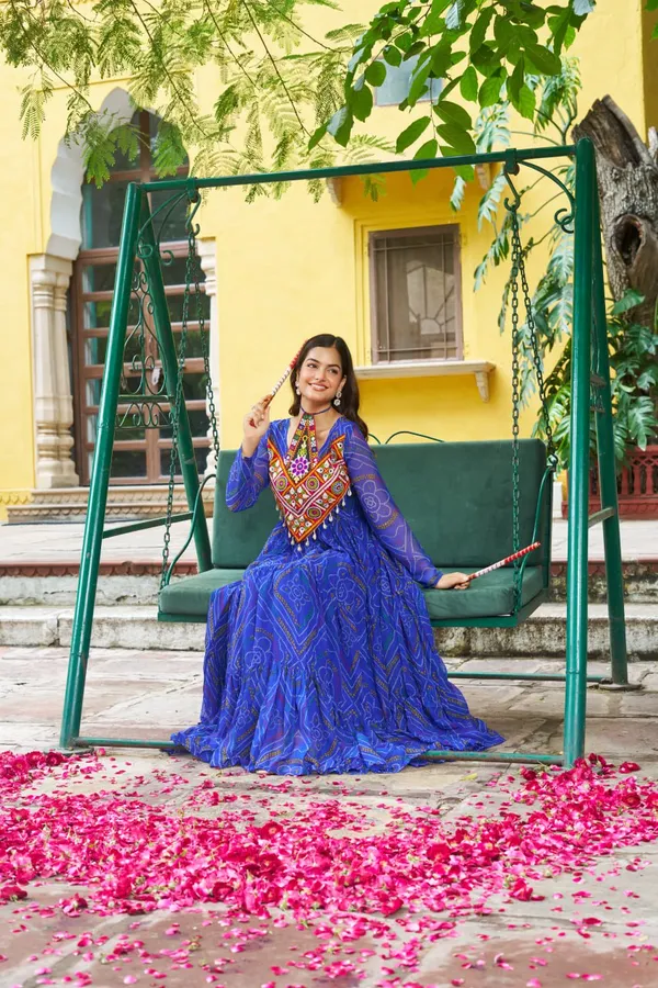Celebrate_this_Navratri_in_full_color_and_culture_with_our_stunning_traditional_maxi_dresses._Featuring_bold_Bandhani_prints_and_handcrafted_mirror-work_yokes,_each_outfit_radiates_ethnic_charm._Choose_your_festive_hue_—_Sunshine_Yellow,_Royal_Purple,_Electric_Blue,_or_Fiery_Red_—_and_dance_through_the_nights_in_comfort_and_elegance.