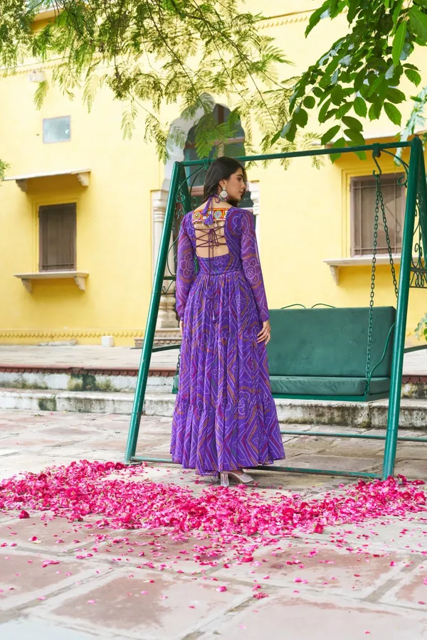 Celebrate_this_Navratri_in_full_color_and_culture_with_our_stunning_traditional_maxi_dresses._Featuring_bold_Bandhani_prints_and_handcrafted_mirror-work_yokes,_each_outfit_radiates_ethnic_charm._Choose_your_festive_hue_—_Sunshine_Yellow,_Royal_Purple,_Electric_Blue,_or_Fiery_Red_—_and_dance_through_the_nights_in_comfort_and_elegance.