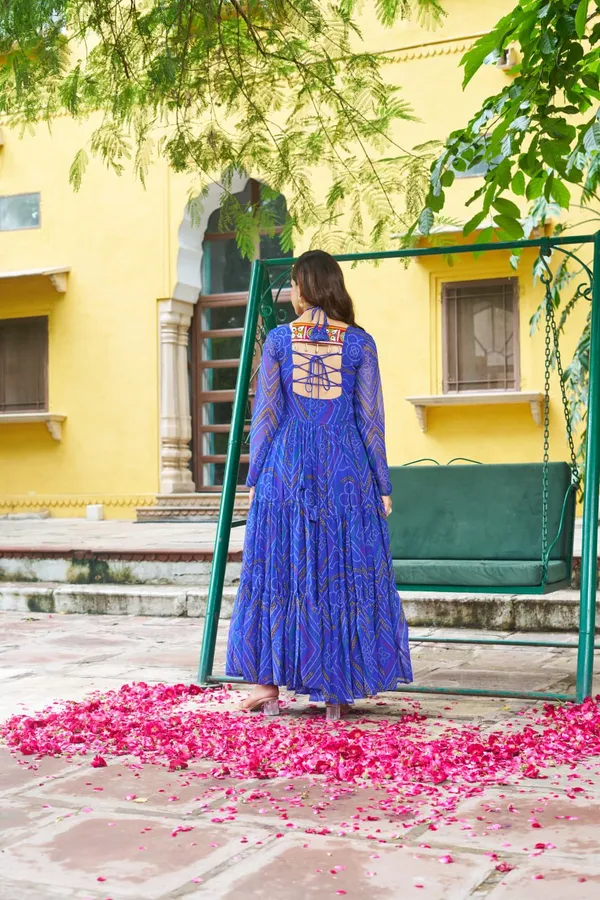 Celebrate_this_Navratri_in_full_color_and_culture_with_our_stunning_traditional_maxi_dresses._Featuring_bold_Bandhani_prints_and_handcrafted_mirror-work_yokes,_each_outfit_radiates_ethnic_charm._Choose_your_festive_hue_—_Sunshine_Yellow,_Royal_Purple,_Electric_Blue,_or_Fiery_Red_—_and_dance_through_the_nights_in_comfort_and_elegance.