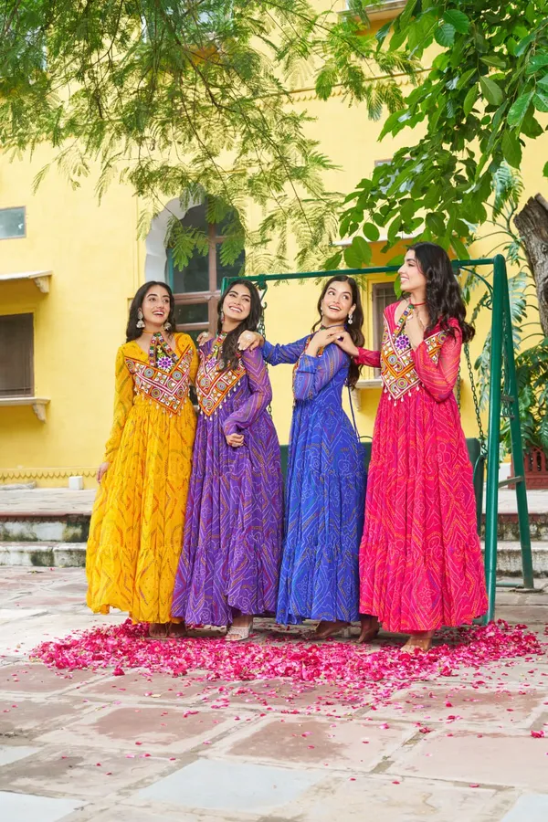 Celebrate_this_Navratri_in_full_color_and_culture_with_our_stunning_traditional_maxi_dresses._Featuring_bold_Bandhani_prints_and_handcrafted_mirror-work_yokes,_each_outfit_radiates_ethnic_charm._Choose_your_festive_hue_—_Sunshine_Yellow,_Royal_Purple,_Electric_Blue,_or_Fiery_Red_—_and_dance_through_the_nights_in_comfort_and_elegance.