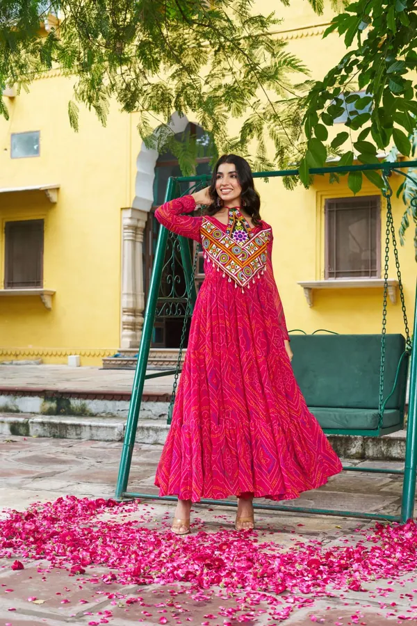 Celebrate_this_Navratri_in_full_color_and_culture_with_our_stunning_traditional_maxi_dresses._Featuring_bold_Bandhani_prints_and_handcrafted_mirror-work_yokes,_each_outfit_radiates_ethnic_charm._Choose_your_festive_hue_—_Sunshine_Yellow,_Royal_Purple,_Electric_Blue,_or_Fiery_Red_—_and_dance_through_the_nights_in_comfort_and_elegance.