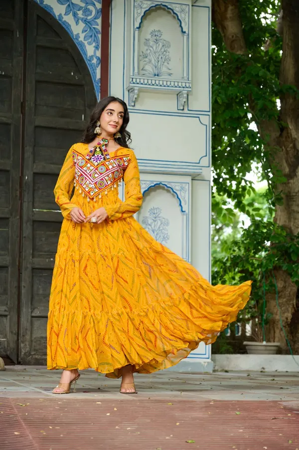 Celebrate_this_Navratri_in_full_color_and_culture_with_our_stunning_traditional_maxi_dresses._Featuring_bold_Bandhani_prints_and_handcrafted_mirror-work_yokes,_each_outfit_radiates_ethnic_charm._Choose_your_festive_hue_—_Sunshine_Yellow,_Royal_Purple,_Electric_Blue,_or_Fiery_Red_—_and_dance_through_the_nights_in_comfort_and_elegance.