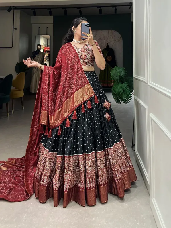 Dance_into_the_divine_spirit_of_Navratri_with_this_regal_black_and_maroon_lehenga,_adorned_in_traditional_prints_and_rich_Banarasi_borders