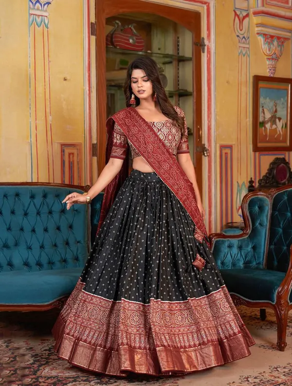 Dance_into_the_divine_spirit_of_Navratri_with_this_regal_black_and_maroon_lehenga,_adorned_in_traditional_prints_and_rich_Banarasi_borders