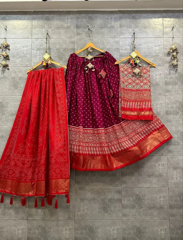 Dance_into_the_divine_spirit_of_Navratri_with_this_regal_black_and_maroon_lehenga,_adorned_in_traditional_prints_and_rich_Banarasi_borders.