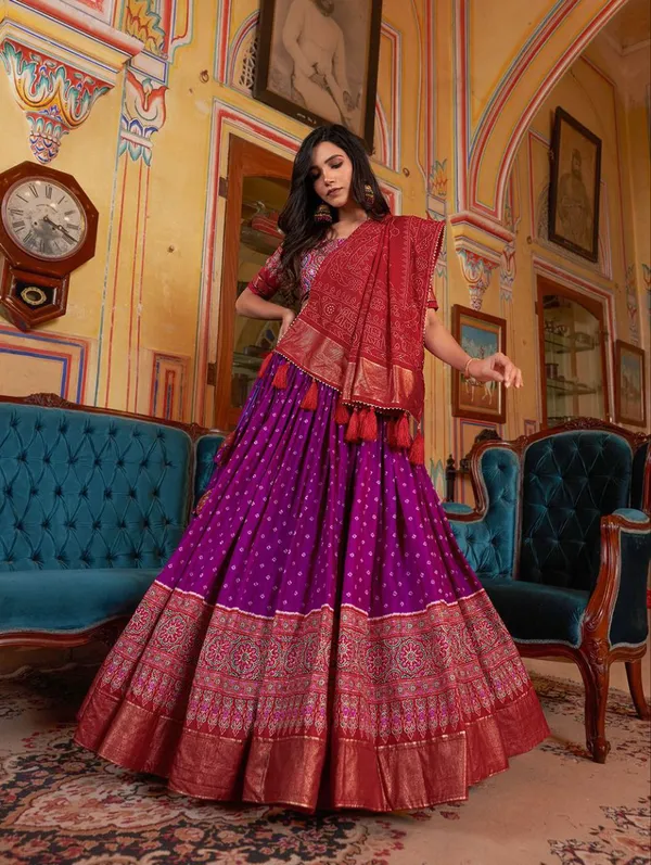 Dance_into_the_divine_spirit_of_Navratri_with_this_regal_black_and_maroon_lehenga,_adorned_in_traditional_prints_and_rich_Banarasi_borders.
