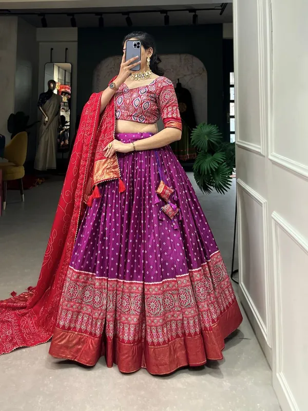 Dance_into_the_divine_spirit_of_Navratri_with_this_regal_black_and_maroon_lehenga,_adorned_in_traditional_prints_and_rich_Banarasi_borders.