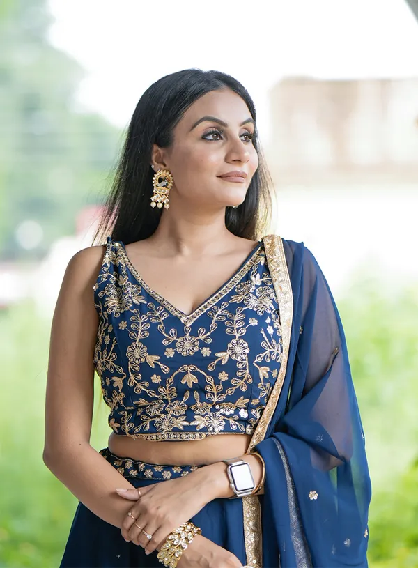 Revel_in_the_charm_of_the_festive_season_with_a_blend_of_regal_and_traditional_silhouettes,_exquisite_sequins_and_thread_embroidery_and_vibrant_hues_exuding_grace_and_finesse.