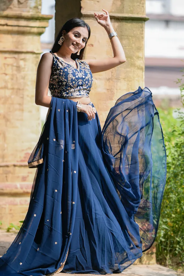 Revel_in_the_charm_of_the_festive_season_with_a_blend_of_regal_and_traditional_silhouettes,_exquisite_sequins_and_thread_embroidery_and_vibrant_hues_exuding_grace_and_finesse.