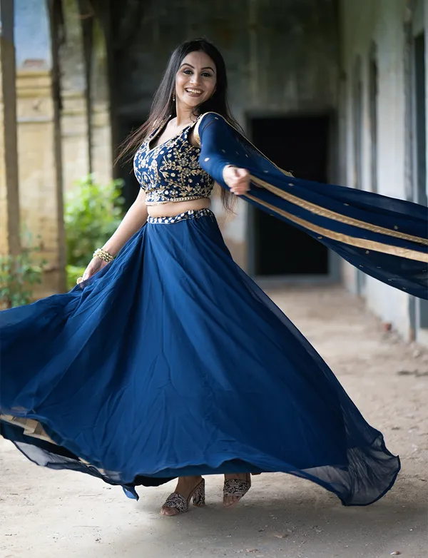 Revel_in_the_charm_of_the_festive_season_with_a_blend_of_regal_and_traditional_silhouettes,_exquisite_sequins_and_thread_embroidery_and_vibrant_hues_exuding_grace_and_finesse.