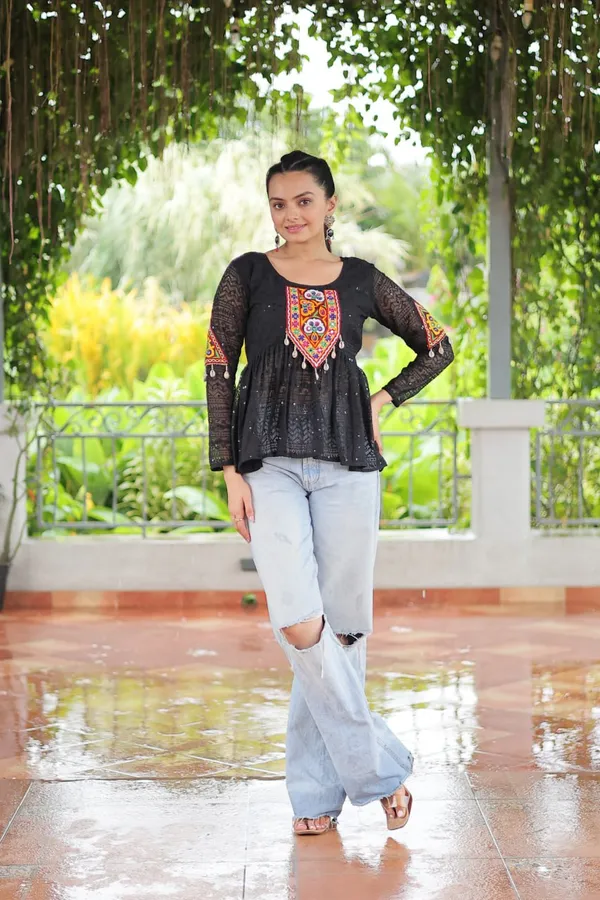 Featuring_mirror-work_embroidered_yokes,_tie-dye_Bandhani_patterns,_and_radiant_colors_like_emerald_green,_mustard_yellow,_and_fuchsia_pink_–_these_flowy_ensembles_are_a_celebration_in_themselves