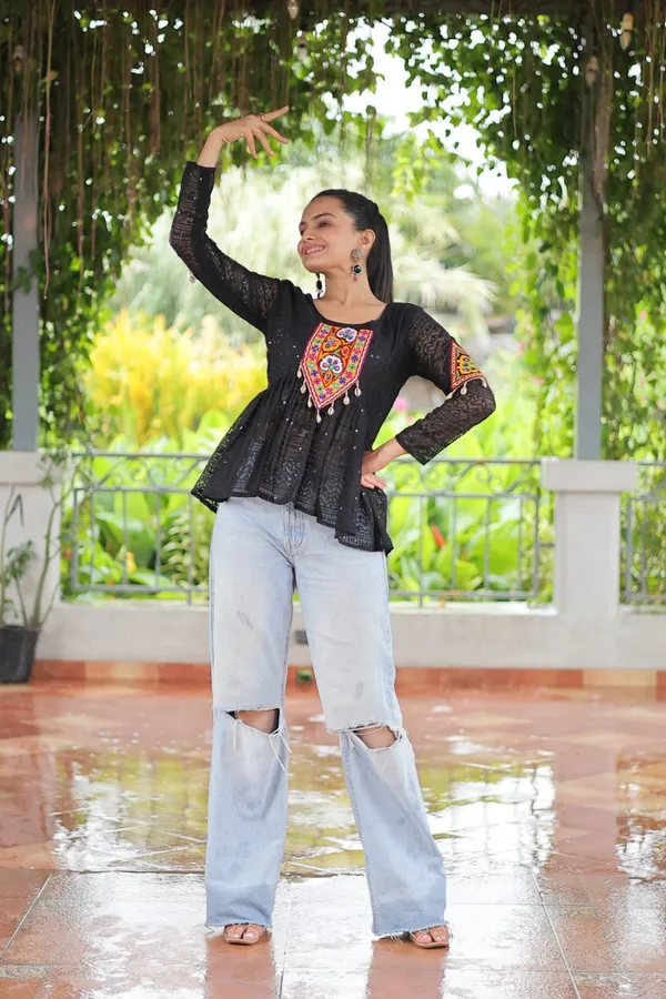 Featuring_mirror-work_embroidered_yokes,_tie-dye_Bandhani_patterns,_and_radiant_colors_like_emerald_green,_mustard_yellow,_and_fuchsia_pink_–_these_flowy_ensembles_are_a_celebration_in_themselves