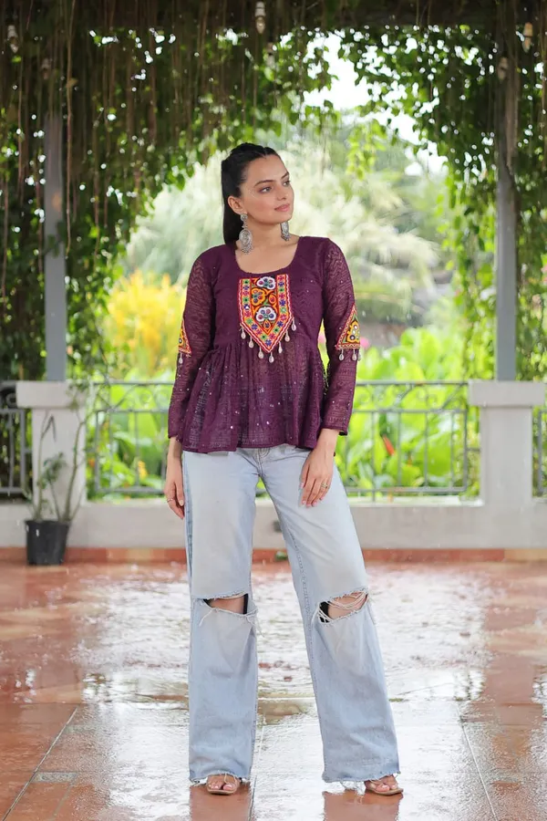 Featuring_mirror-work_embroidered_yokes,_tie-dye_Bandhani_patterns,_and_radiant_colors_like_emerald_green,_mustard_yellow,_and_fuchsia_pink_–_these_flowy_ensembles_are_a_celebration_in_themselves
