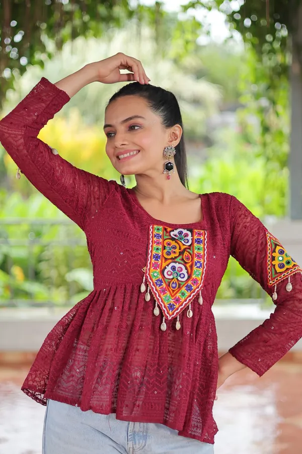 Featuring_mirror-work_embroidered_yokes,_tie-dye_Bandhani_patterns,_and_radiant_colors_like_emerald_green,_mustard_yellow,_and_fuchsia_pink_–_these_flowy_ensembles_are_a_celebration_in_themselves