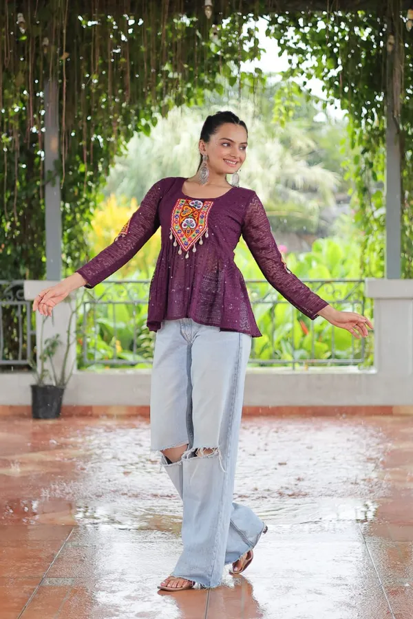 Featuring_mirror-work_embroidered_yokes,_tie-dye_Bandhani_patterns,_and_radiant_colors_like_emerald_green,_mustard_yellow,_and_fuchsia_pink_–_these_flowy_ensembles_are_a_celebration_in_themselves