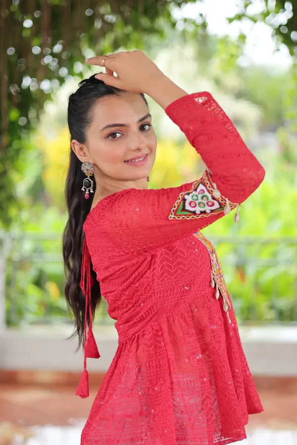 Featuring_mirror-work_embroidered_yokes,_tie-dye_Bandhani_patterns,_and_radiant_colors_like_emerald_green,_mustard_yellow,_and_fuchsia_pink_–_these_flowy_ensembles_are_a_celebration_in_themselves