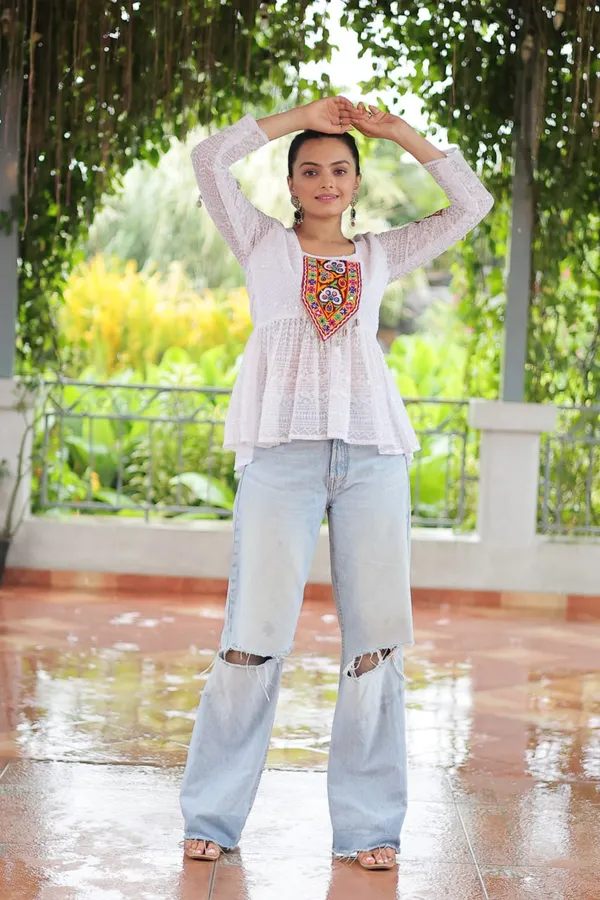 Featuring_mirror-work_embroidered_yokes,_tie-dye_Bandhani_patterns,_and_radiant_colors_like_emerald_green,_mustard_yellow,_and_fuchsia_pink_–_these_flowy_ensembles_are_a_celebration_in_themselves