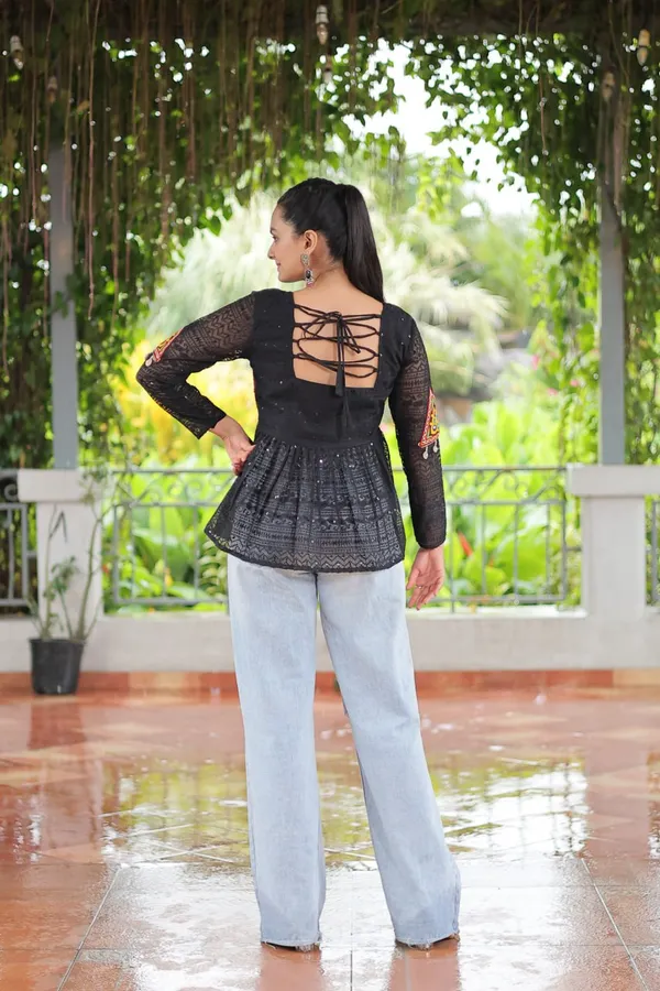 Featuring_mirror-work_embroidered_yokes,_tie-dye_Bandhani_patterns,_and_radiant_colors_like_emerald_green,_mustard_yellow,_and_fuchsia_pink_–_these_flowy_ensembles_are_a_celebration_in_themselves