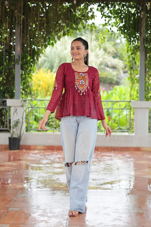 Featuring_mirror-work_embroidered_yokes,_tie-dye_Bandhani_patterns,_and_radiant_colors_like_emerald_green,_mustard_yellow,_and_fuchsia_pink_–_these_flowy_ensembles_are_a_celebration_in_themselves