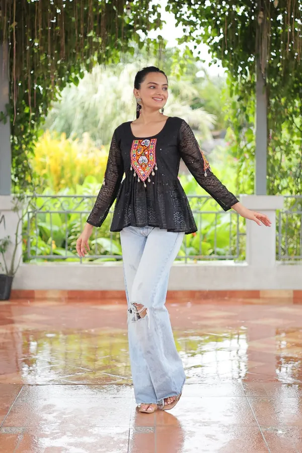 Featuring_mirror-work_embroidered_yokes,_tie-dye_Bandhani_patterns,_and_radiant_colors_like_emerald_green,_mustard_yellow,_and_fuchsia_pink_–_these_flowy_ensembles_are_a_celebration_in_themselves