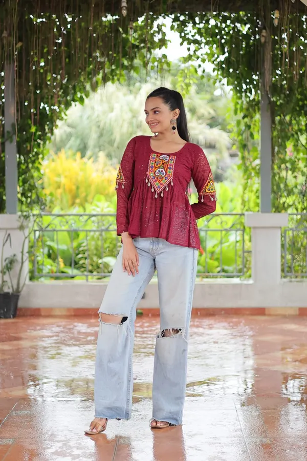 Featuring_mirror-work_embroidered_yokes,_tie-dye_Bandhani_patterns,_and_radiant_colors_like_emerald_green,_mustard_yellow,_and_fuchsia_pink_–_these_flowy_ensembles_are_a_celebration_in_themselves