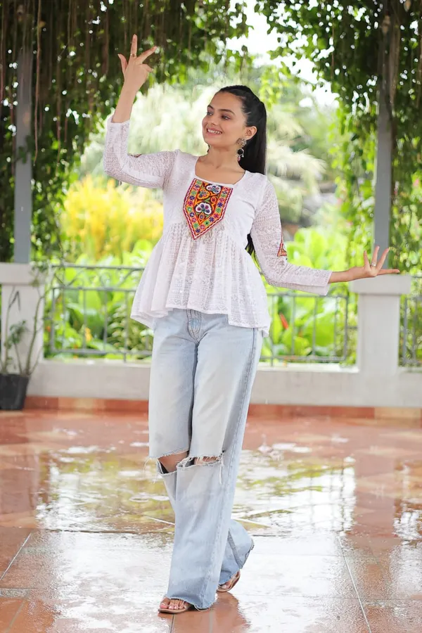 Featuring_mirror-work_embroidered_yokes,_tie-dye_Bandhani_patterns,_and_radiant_colors_like_emerald_green,_mustard_yellow,_and_fuchsia_pink_–_these_flowy_ensembles_are_a_celebration_in_themselves
