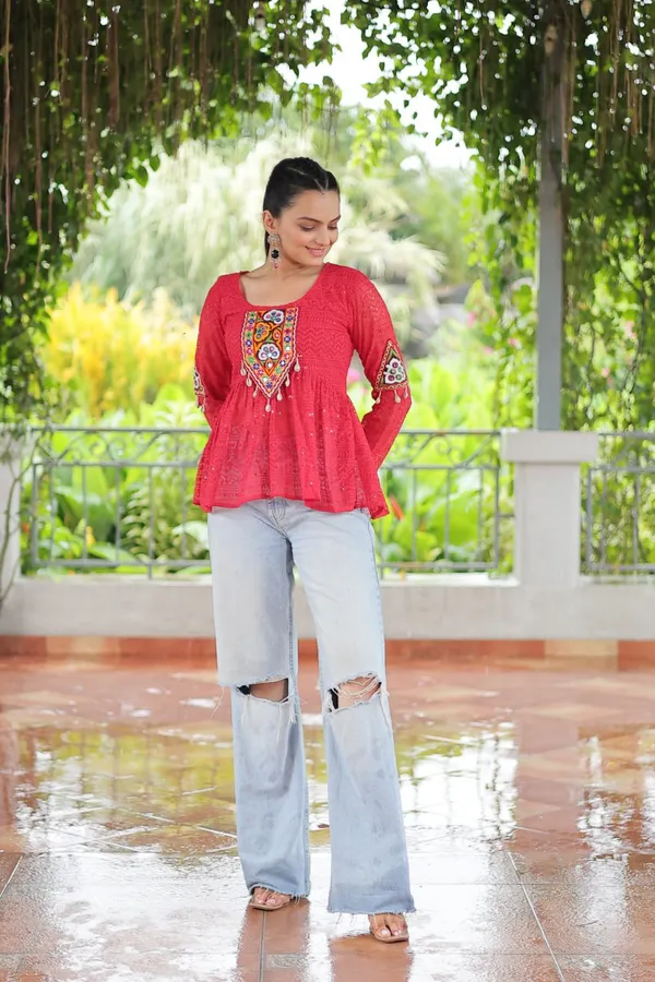 Featuring_mirror-work_embroidered_yokes,_tie-dye_Bandhani_patterns,_and_radiant_colors_like_emerald_green,_mustard_yellow,_and_fuchsia_pink_–_these_flowy_ensembles_are_a_celebration_in_themselves