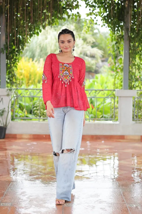 Featuring_mirror-work_embroidered_yokes,_tie-dye_Bandhani_patterns,_and_radiant_colors_like_emerald_green,_mustard_yellow,_and_fuchsia_pink_–_these_flowy_ensembles_are_a_celebration_in_themselves