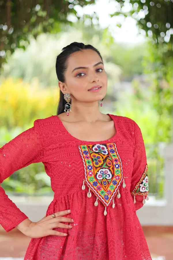 Featuring_mirror-work_embroidered_yokes,_tie-dye_Bandhani_patterns,_and_radiant_colors_like_emerald_green,_mustard_yellow,_and_fuchsia_pink_–_these_flowy_ensembles_are_a_celebration_in_themselves