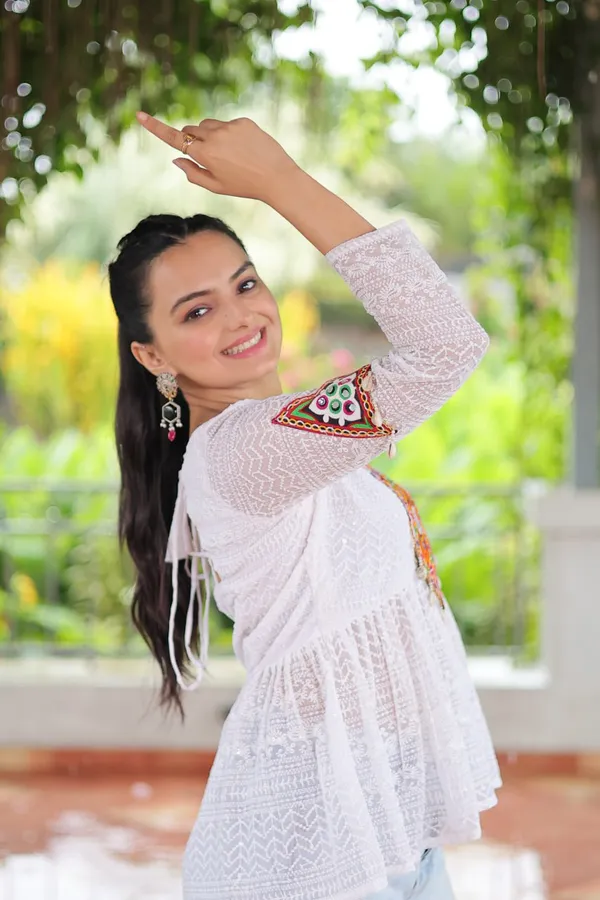 Featuring_mirror-work_embroidered_yokes,_tie-dye_Bandhani_patterns,_and_radiant_colors_like_emerald_green,_mustard_yellow,_and_fuchsia_pink_–_these_flowy_ensembles_are_a_celebration_in_themselves