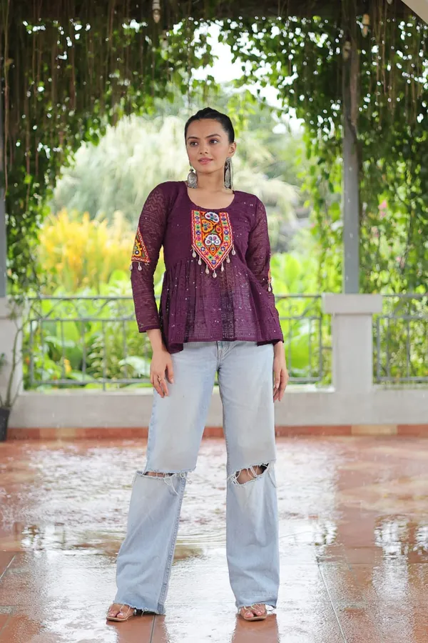 Featuring_mirror-work_embroidered_yokes,_tie-dye_Bandhani_patterns,_and_radiant_colors_like_emerald_green,_mustard_yellow,_and_fuchsia_pink_–_these_flowy_ensembles_are_a_celebration_in_themselves
