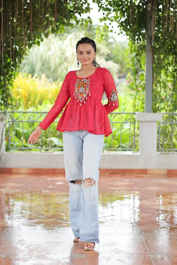 Featuring_mirror-work_embroidered_yokes,_tie-dye_Bandhani_patterns,_and_radiant_colors_like_emerald_green,_mustard_yellow,_and_fuchsia_pink_–_these_flowy_ensembles_are_a_celebration_in_themselves