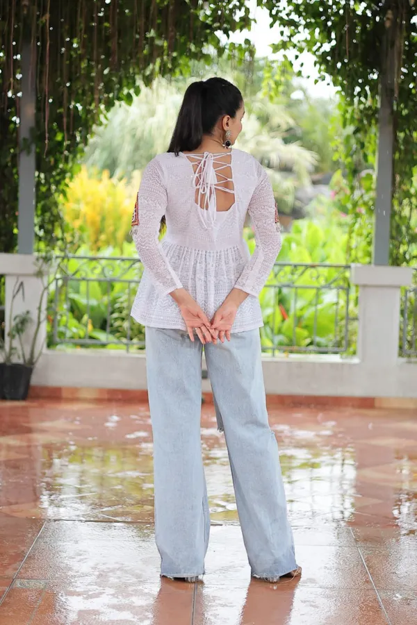 Featuring_mirror-work_embroidered_yokes,_tie-dye_Bandhani_patterns,_and_radiant_colors_like_emerald_green,_mustard_yellow,_and_fuchsia_pink_–_these_flowy_ensembles_are_a_celebration_in_themselves