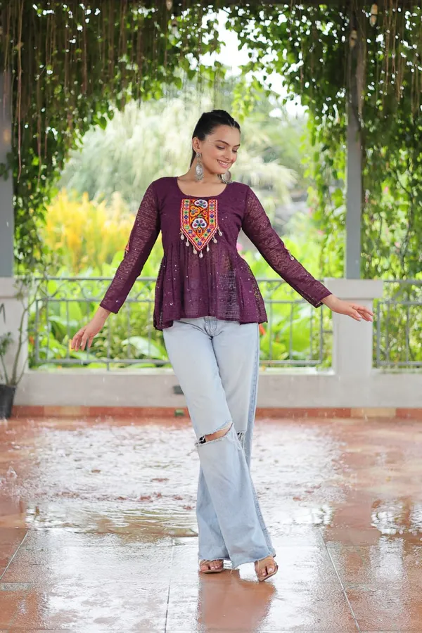 Featuring_mirror-work_embroidered_yokes,_tie-dye_Bandhani_patterns,_and_radiant_colors_like_emerald_green,_mustard_yellow,_and_fuchsia_pink_–_these_flowy_ensembles_are_a_celebration_in_themselves