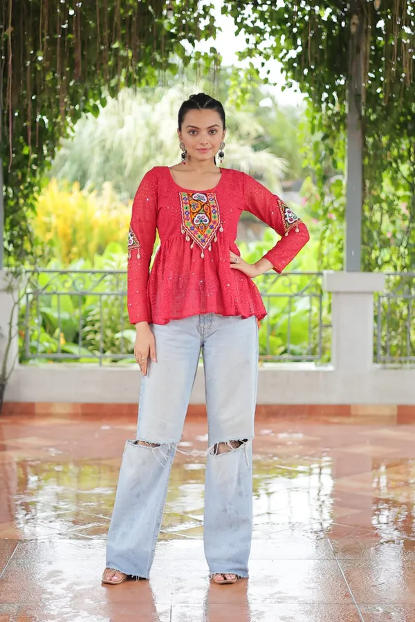 Featuring_mirror-work_embroidered_yokes,_tie-dye_Bandhani_patterns,_and_radiant_colors_like_emerald_green,_mustard_yellow,_and_fuchsia_pink_–_these_flowy_ensembles_are_a_celebration_in_themselves