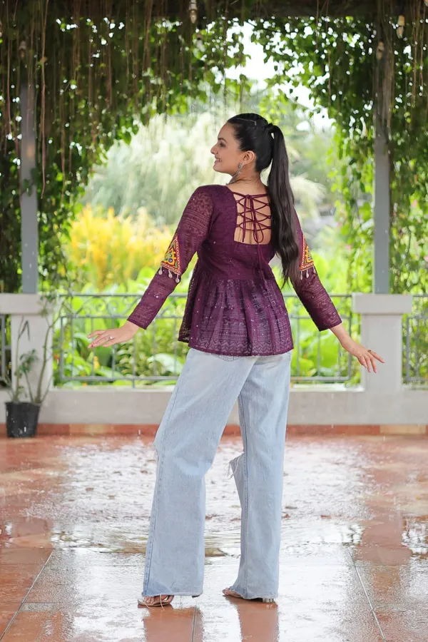 Featuring_mirror-work_embroidered_yokes,_tie-dye_Bandhani_patterns,_and_radiant_colors_like_emerald_green,_mustard_yellow,_and_fuchsia_pink_–_these_flowy_ensembles_are_a_celebration_in_themselves