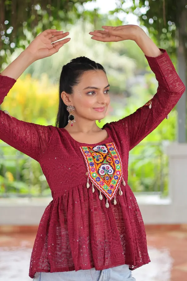 Featuring_mirror-work_embroidered_yokes,_tie-dye_Bandhani_patterns,_and_radiant_colors_like_emerald_green,_mustard_yellow,_and_fuchsia_pink_–_these_flowy_ensembles_are_a_celebration_in_themselves