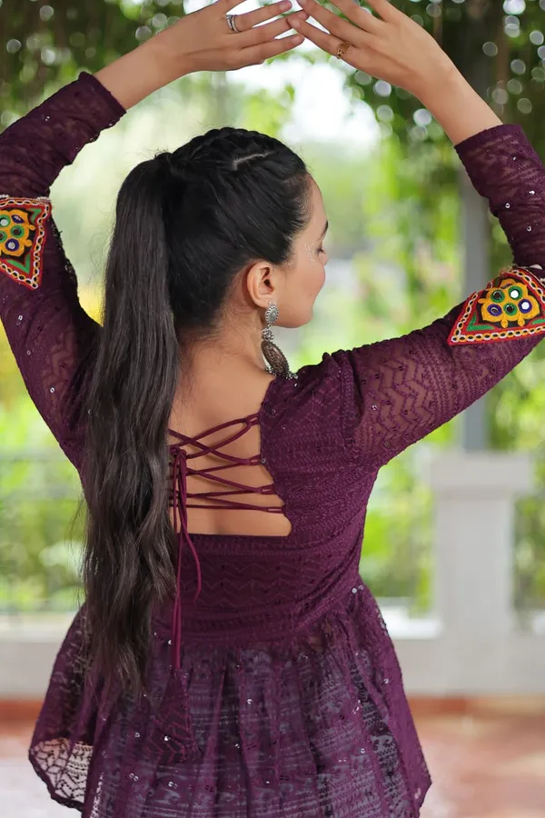 Featuring_mirror-work_embroidered_yokes,_tie-dye_Bandhani_patterns,_and_radiant_colors_like_emerald_green,_mustard_yellow,_and_fuchsia_pink_–_these_flowy_ensembles_are_a_celebration_in_themselves