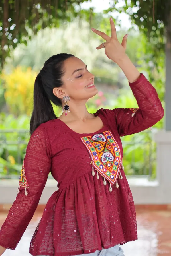 Featuring_mirror-work_embroidered_yokes,_tie-dye_Bandhani_patterns,_and_radiant_colors_like_emerald_green,_mustard_yellow,_and_fuchsia_pink_–_these_flowy_ensembles_are_a_celebration_in_themselves