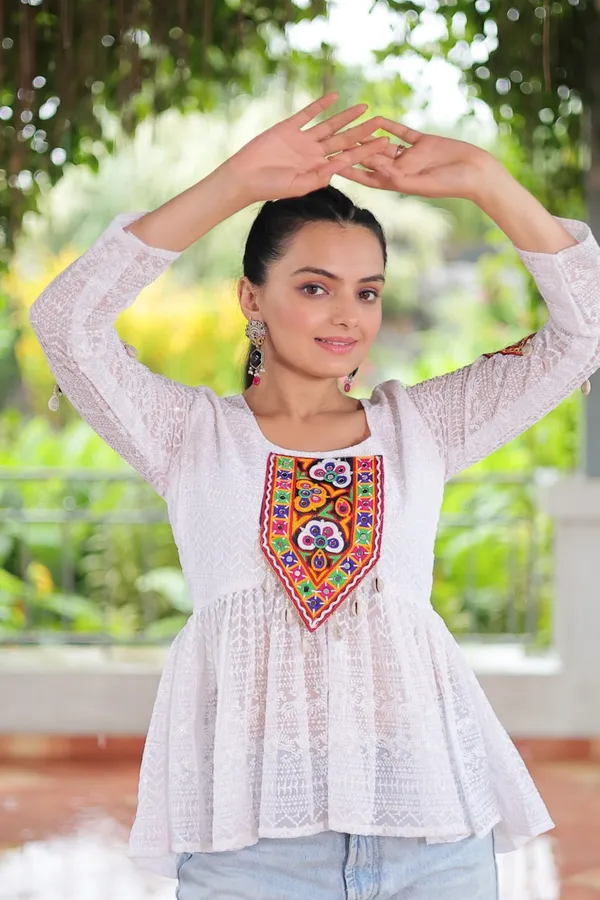 Featuring_mirror-work_embroidered_yokes,_tie-dye_Bandhani_patterns,_and_radiant_colors_like_emerald_green,_mustard_yellow,_and_fuchsia_pink_–_these_flowy_ensembles_are_a_celebration_in_themselves