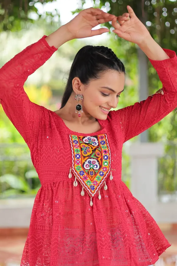 Featuring_mirror-work_embroidered_yokes,_tie-dye_Bandhani_patterns,_and_radiant_colors_like_emerald_green,_mustard_yellow,_and_fuchsia_pink_–_these_flowy_ensembles_are_a_celebration_in_themselves