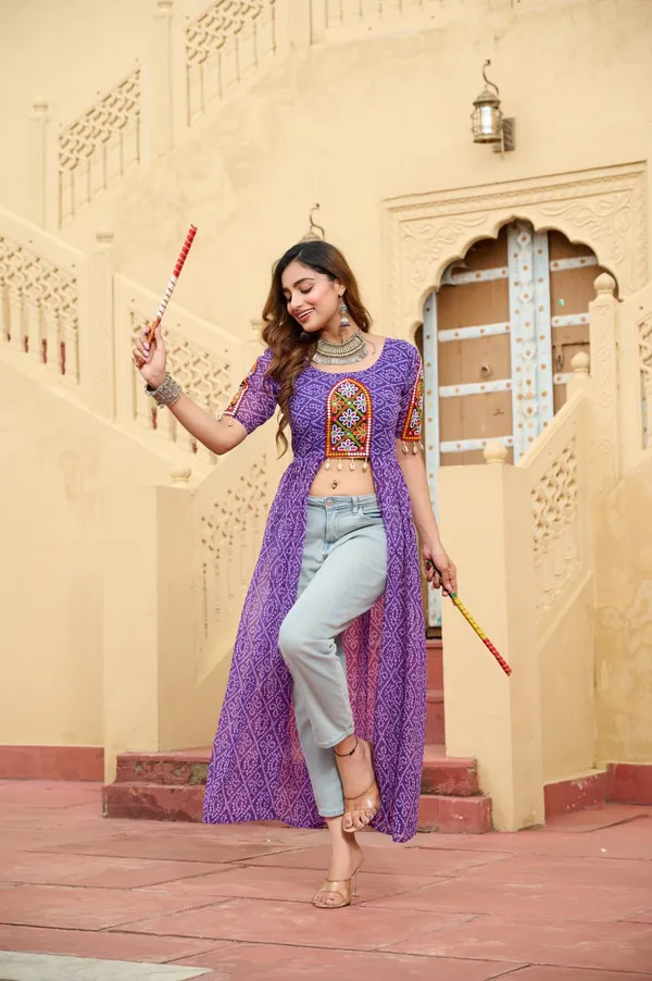 Perfect_for_Garba_nights_and_Dandiya_Raas,_each_outfit_is_paired_with_classic_oxidized_jewelry_and_colorful_dandiyas_to_complete_your_traditional_diva_look.
