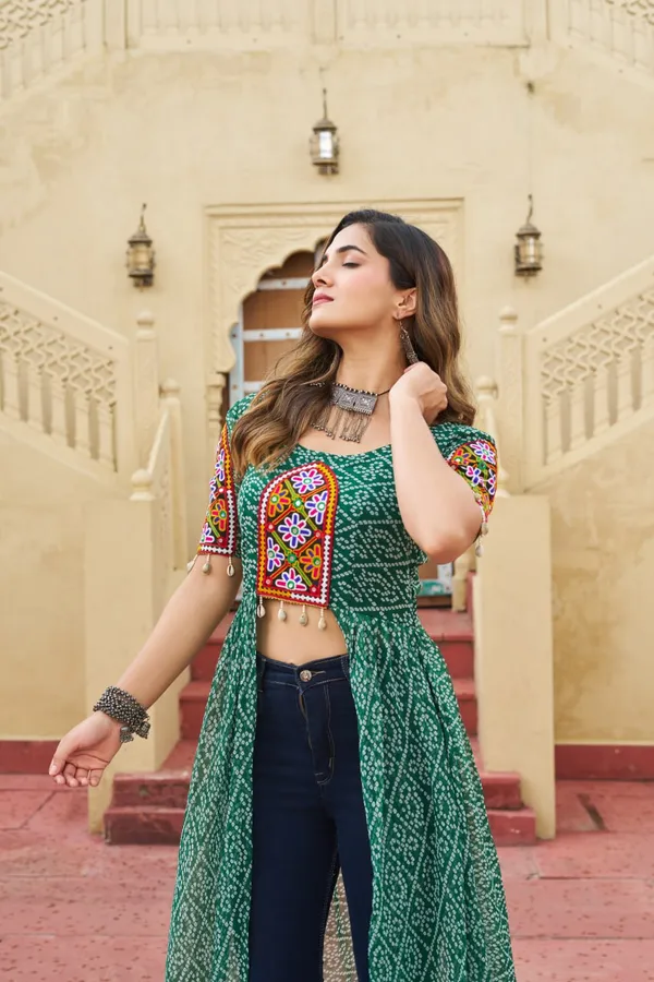 Perfect_for_Garba_nights_and_Dandiya_Raas,_each_outfit_is_paired_with_classic_oxidized_jewelry_and_colorful_dandiyas_to_complete_your_traditional_diva_look.