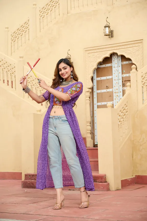 Perfect_for_Garba_nights_and_Dandiya_Raas,_each_outfit_is_paired_with_classic_oxidized_jewelry_and_colorful_dandiyas_to_complete_your_traditional_diva_look.