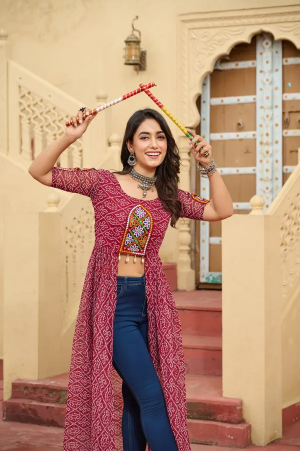 Perfect_for_Garba_nights_and_Dandiya_Raas,_each_outfit_is_paired_with_classic_oxidized_jewelry_and_colorful_dandiyas_to_complete_your_traditional_diva_look.