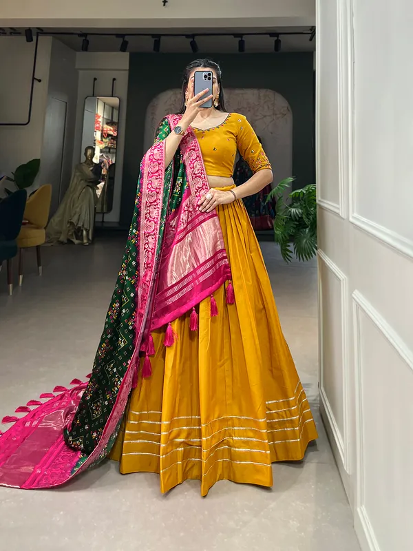 Step_into_a_world_of_elegance_and_grace_with_the_delicate_charm_of_pure_cotton_lehenga_and_the_lustrous_allure_of_gaji_silk_dupatta