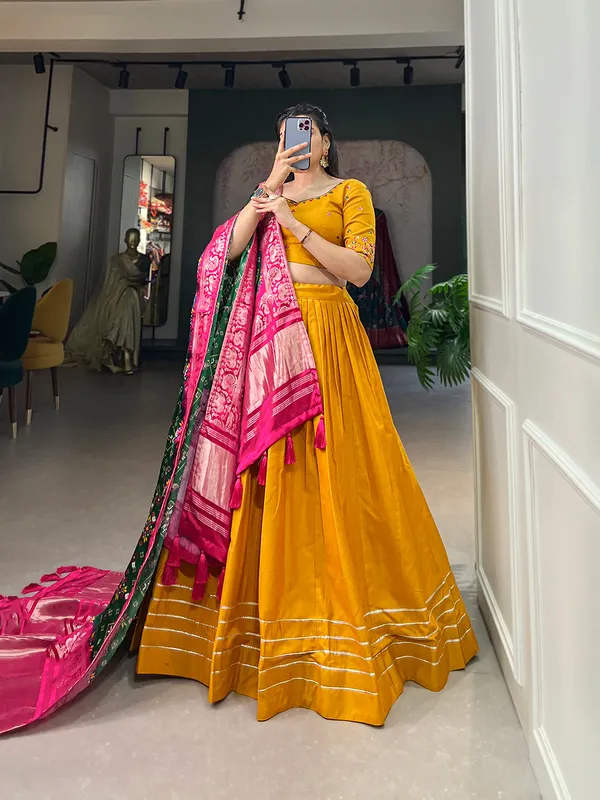 Step_into_a_world_of_elegance_and_grace_with_the_delicate_charm_of_pure_cotton_lehenga_and_the_lustrous_allure_of_gaji_silk_dupatta