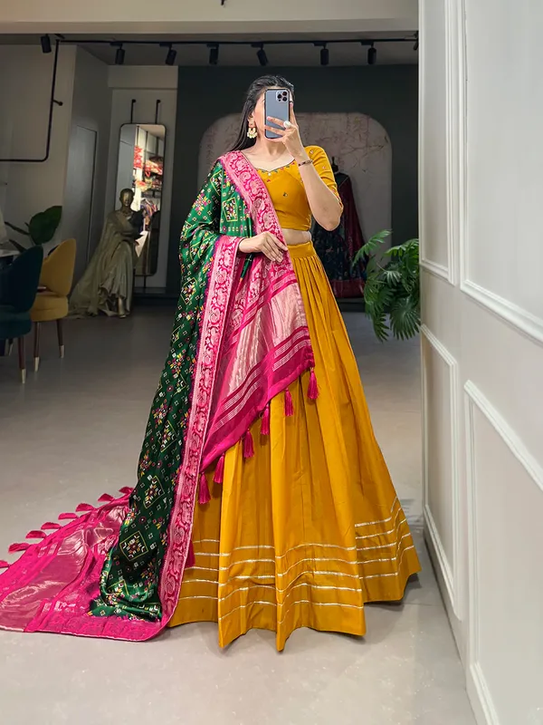 Step_into_a_world_of_elegance_and_grace_with_the_delicate_charm_of_pure_cotton_lehenga_and_the_lustrous_allure_of_gaji_silk_dupatta
