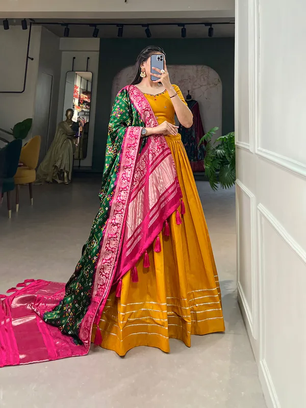 Step_into_a_world_of_elegance_and_grace_with_the_delicate_charm_of_pure_cotton_lehenga_and_the_lustrous_allure_of_gaji_silk_dupatta